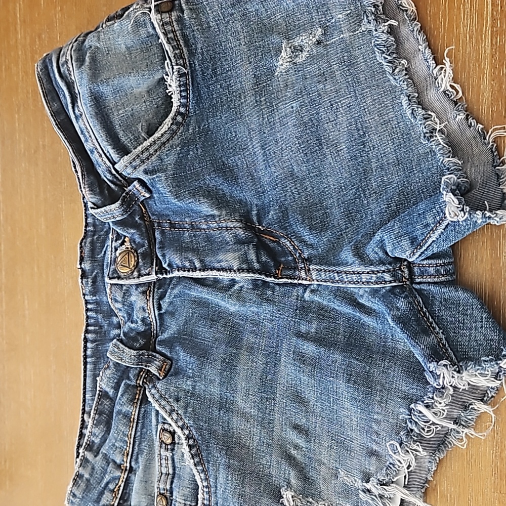 VERSACE DISTRESSED DENIM FRINGED SHORTS